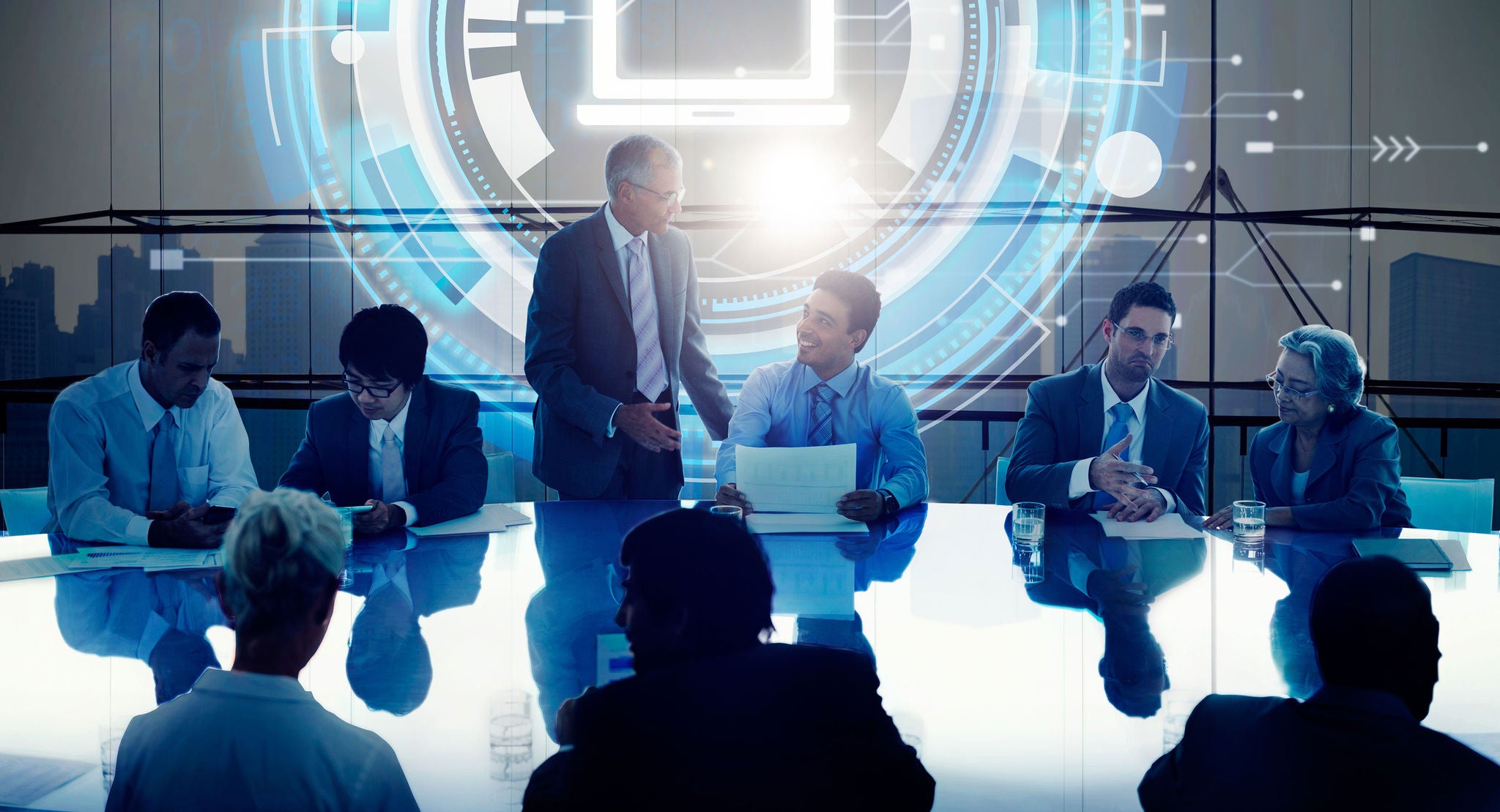 Business leaders discussing digital transformation strategy in a modern boardroom